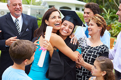 Family hugging their daughter who recently graduated made possible with college funding plan